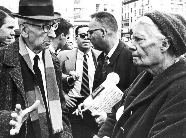 Dorothy Day listens to CNVA chairman AJ Muste, Union Square Park, 1966